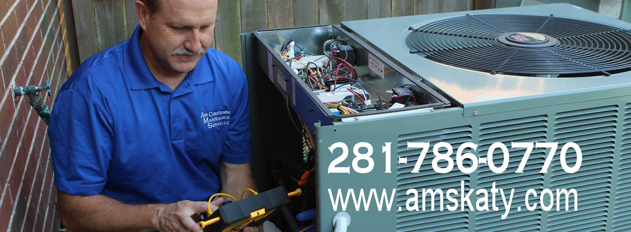 A man working on an air conditioner unit.